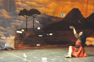 Drops of fortune: Actress Hanny Herlina looks up at money falling from the sky. Garasi actors impersonate Tarling-Dangdut performers, who in real life, receive money thrown or given to them by the audience. — Photo by courtesy of Festival Salihara