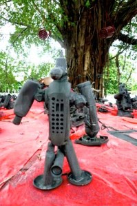  Tree monster: Toy robots made of plastic waste have been placed under a banyan tree in Theater Jakarta’s open space as part of an installation by Atap Alis Community.